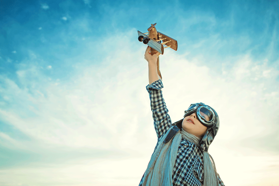 Child with a toy aeroplane